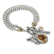 A silver-toned charm bracelet with a charm featuring a lion and the word "Courage" engraved on it.