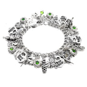 A silver charm bracelet with various charms and charms attached to it.