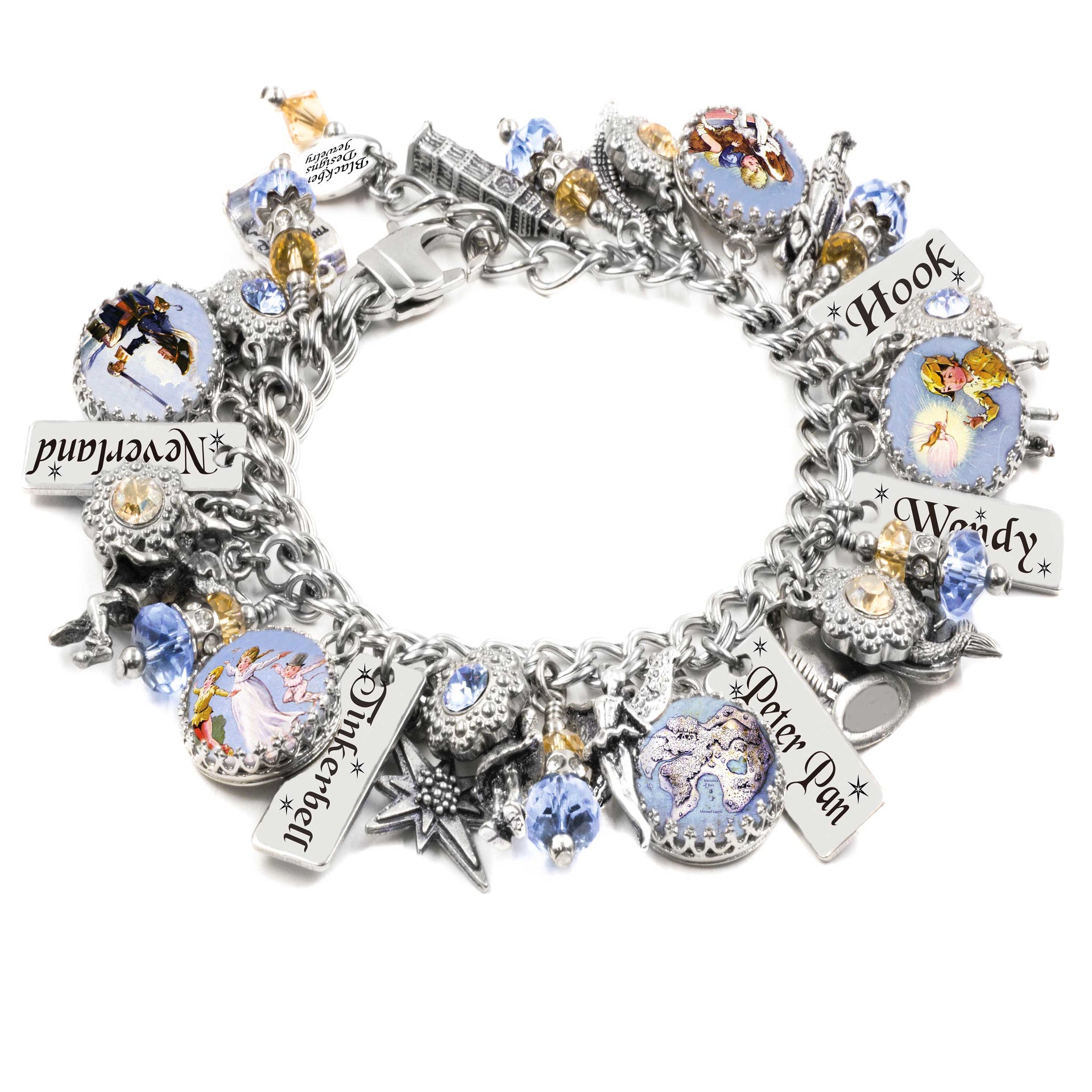 A silver-colored charm bracelet adorned with various charms, including a small bird, a star, and a castle. The bracelet also features charms with the names 'Peter Pan' and 'Weedy' on them.