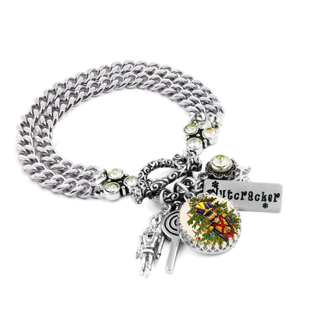 A silver-toned bracelet with various charms and pendants, including a pendant with a floral design and a small metal figure.