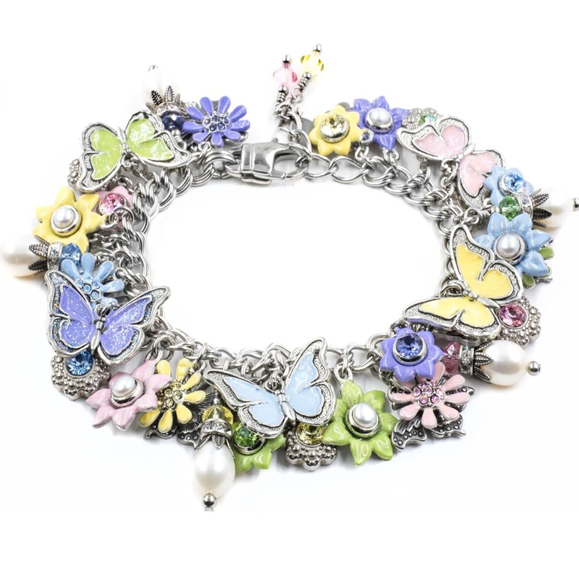 A colorful charm bracelet with various decorative elements, including flowers, butterflies, and pearls.
