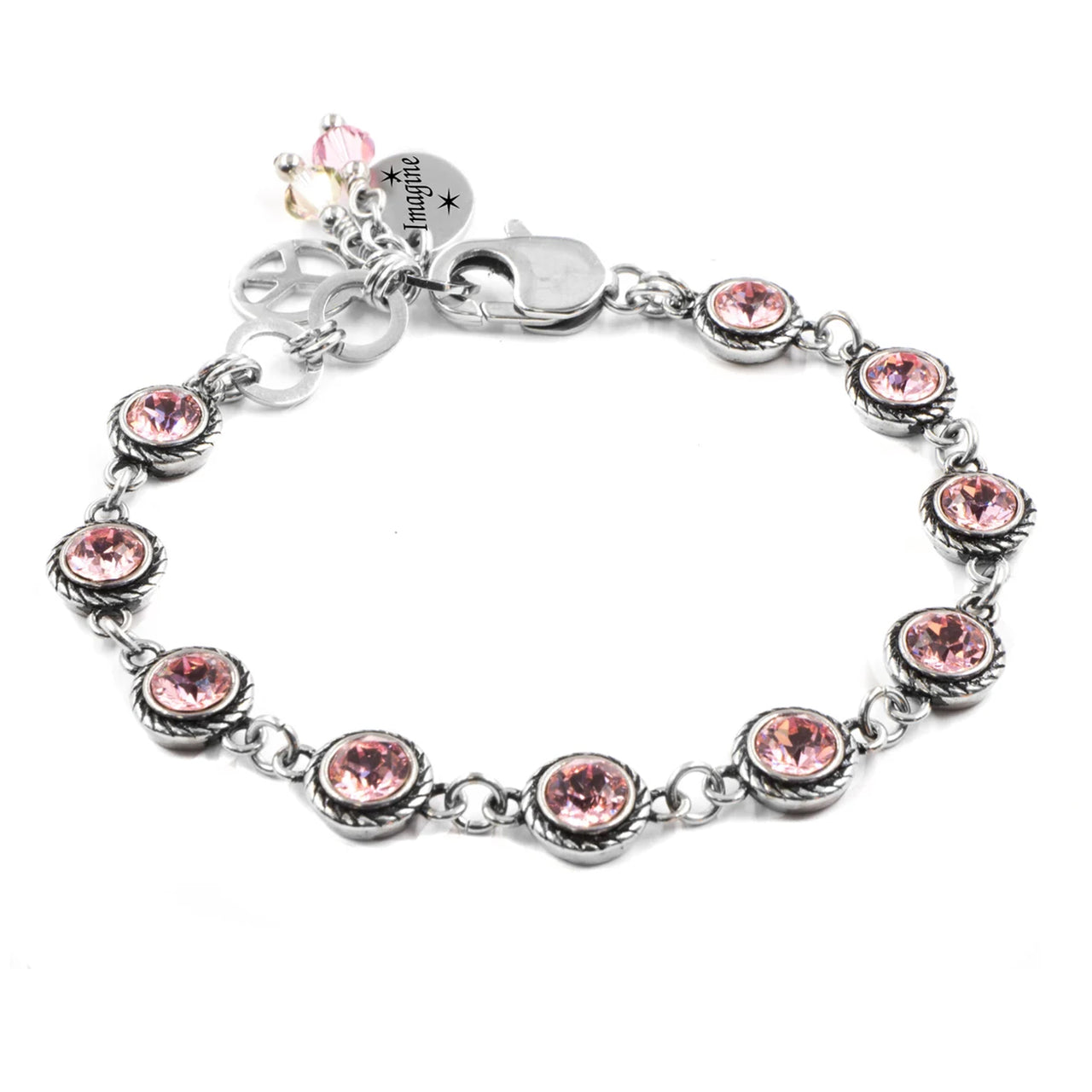 A silver-toned bracelet adorned with multiple round gemstones, including pink and clear stones, creating a visually appealing and elegant design.
