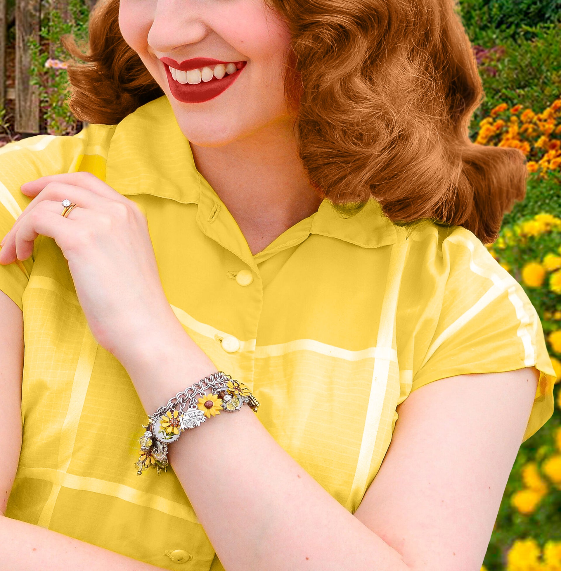closeup of woman wearing sunflower jewelry - charm bracelet