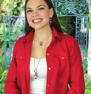 woman in red wearing silver ladybug necklace