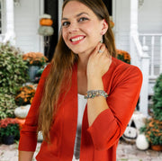 woman in red wearing hocus pocus jewelry